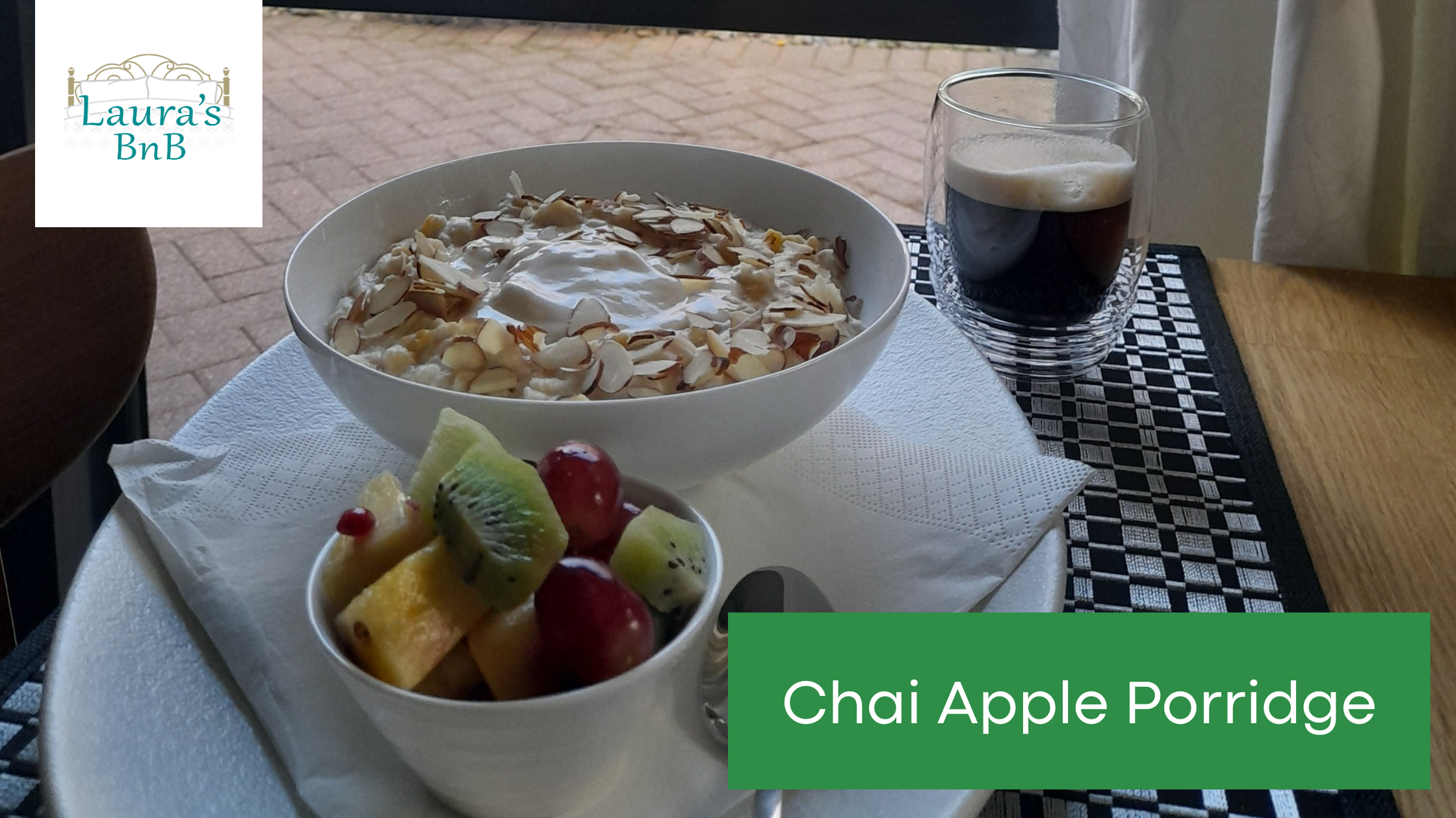 Photo of a bowl of Chai Apple Porridge with a side serving of fresh fruit salad and a cup of coffee